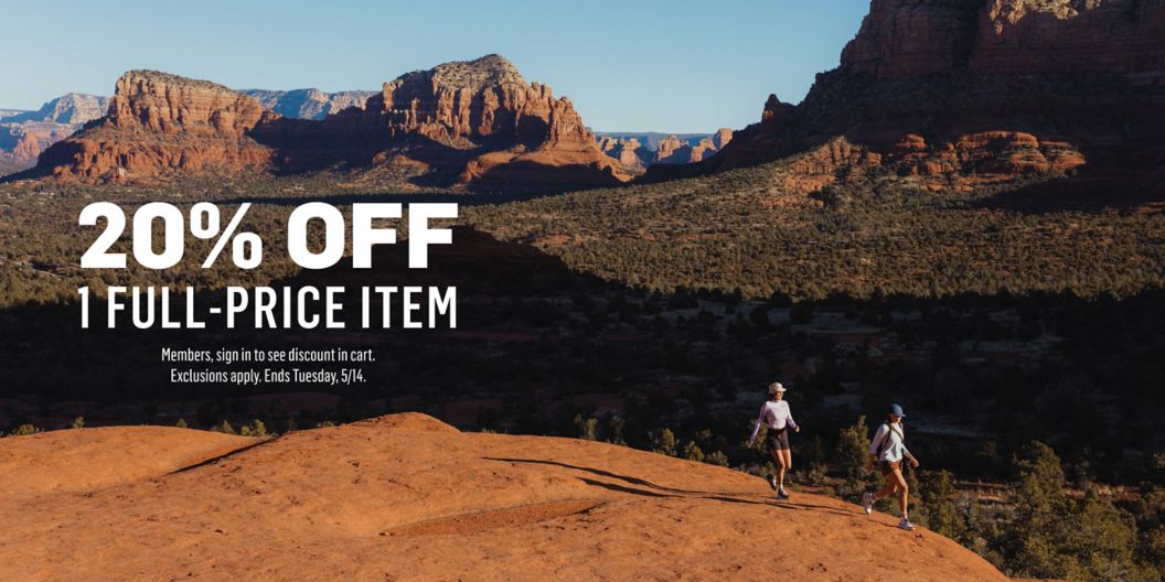 Two people hike across slickrock in canyon country. Text overlay reads 20% off 1 full-price item. Members, sign in & discount will apply in cart. Exclusions apply. Ends Tuesday, 5/14.